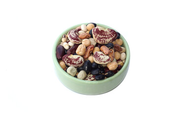 A variety of beans in a cup, such as red, black, black-eyed white, green peas, white peas, peas, tiger, sippeas, azuki beans other.