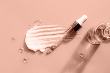 Demonstrating color of the year 2025. Mocha mousse color swatch. Cosmetic serum glass bottle skincare facial treatment, cream, gel, oil dropper pipette