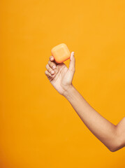 Hand Holding Orange Square Soap Bar Cleanliness Hygiene Product