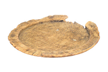 A round wooden dish with a cracked surface and jagged edge, showing signs of wear and age.