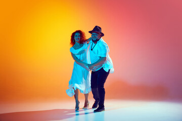 Couple refines their salsa technique, focusing on rhythm and fluidity, showcasing their passion for...