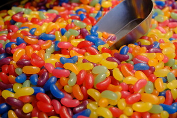 Close-up of colorful jelly beans for children sold in a dessert shop. Food industry. Dessert varieties. Junk food, fun candies.