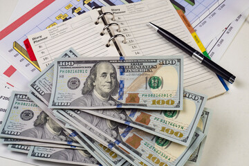 heap of one hundred dollar bills as background, close-up