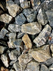 Image of a pile of black and gray rocks mixed together for construction.