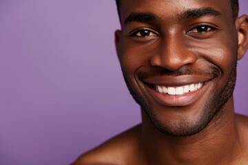 Fototapeta premium Portrait of a man focusing on facial skincare in a studio, highlighting personal hygiene and natural cosmetics against a purple backdrop. Happy mature man showcasing beauty and wellness