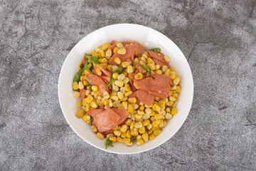 Fried corn kernels with ham sausage