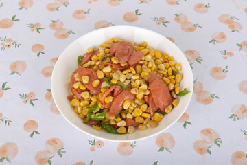 Fried corn kernels with ham sausage