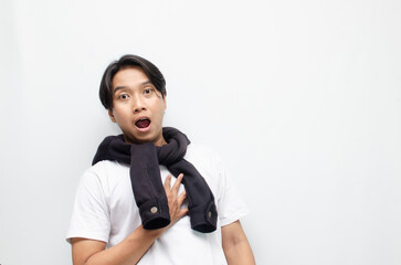 Happy and Surprised Young Asian Man in Casual Outfit Celebrating Victory