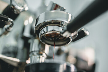 Close-up of Bottomless Portafilter Brewing Fresh Espresso with Rich Crema in a Coffee Machine