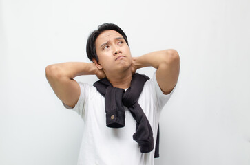Young Asian Man Deep in Thought with a Pensive Expression