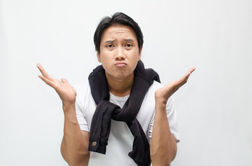 Young Asian Man Deep in Thought with a Pensive Expression