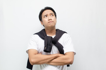 Young Asian Man Deep in Thought with a Pensive Expression