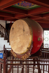 Naklejka premium A large drum on the bell and drum tower in Deyang city, Sichuan province, China