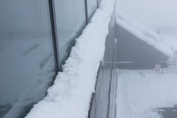 Snow on the eaves on a snowy day