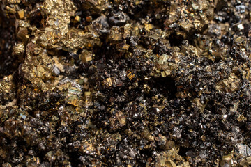 Pyrite mineral flower black and golden color soft focus close up, abstract pattern structure
