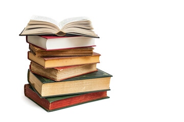 Vintage hard cover books stacked with an opened book on top, isolated on white background, abstract backdrop