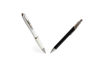 Two roller ball pens standing and  levitating on white background, close up with copy space