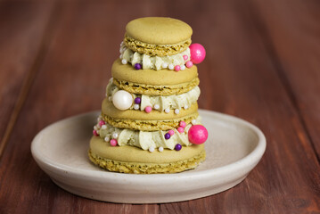 French Christmas tree macaroons on a wooden table. Merry Christmas and Happy New Year.