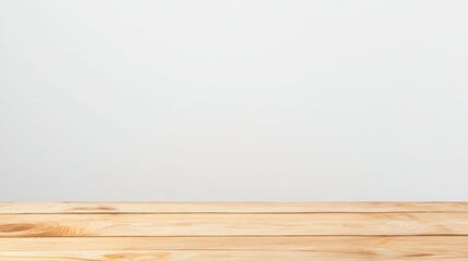 Naklejka premium A simple wooden table against a plain white background, ideal for product photography.
