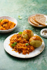 Stewed cabbage with dumplings and gravy