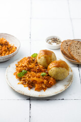 Stewed cabbage with dumplings and gravy