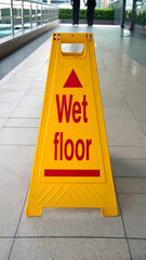 Yellow "Wet Floor" sign, cleaning, caution warning