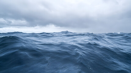 A stormy horizon with endless waves under churning ominous clouds creating a vast and foreboding seascape.