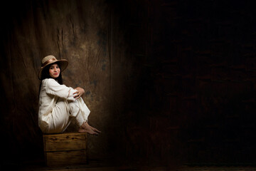 Fototapeta premium Solo Image of a Beautiful Female Model in White Linen Shirt and Trousers