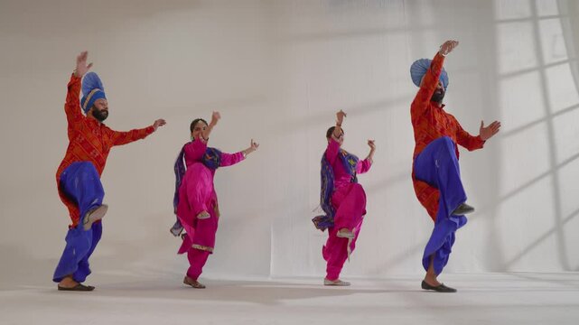 Sikh Couples performing bhangra during Baisakhi Celebration