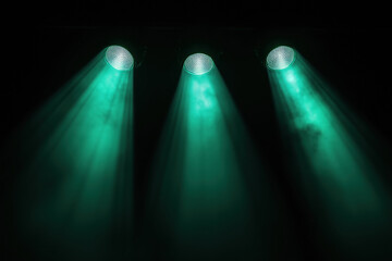 Bright light radiates beams down in mist and fog. Isolated black background glows with ethereal fantasy light. God’s rays create mystical and magical ambiance.