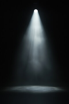 Bright spotlight radiates beams of light down. Smoke and fog generate ethereal glow. Black background features God&rsquo;s rays shining in mystical stage light.