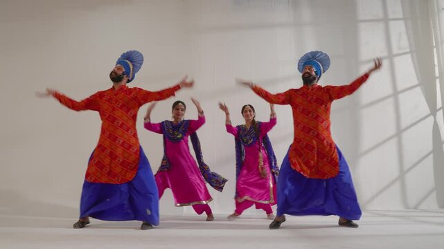 Couples performing bhangra during Baisakhi Celebration