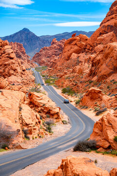 Scenic road in the famous &ldquo;Valley of Fire&ldquo; State Park, a public recreation and nature preservation area south of Overton, Nevada (USA) in Mojave Desert, near Las Vegas. Red sandstone frames the street