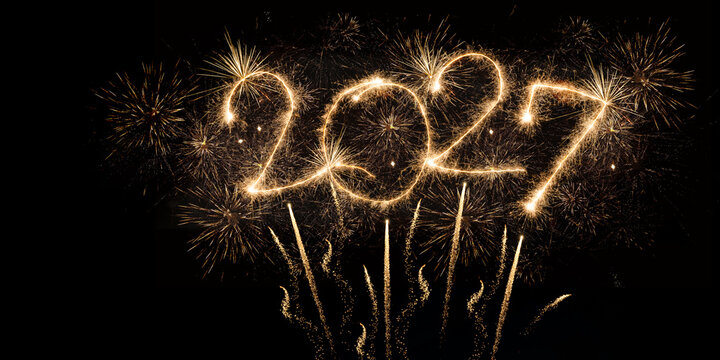happy new year, new year's eve, silvester, new year, celebration greeting card, new year card - Year 2027 in sparkler font and firework fireworks pyrotechnic, isolated on black night sky background