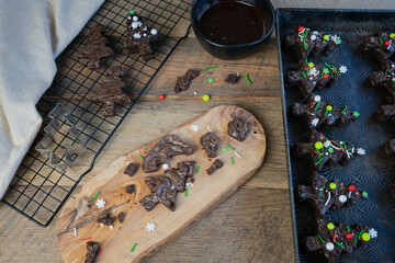 Chocolate brownie and ganache sandwiches decorated with colorful holiday sprinkles candies.
