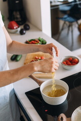 Cooking a healthy meal in a modern kitchen with fresh ingredients and focus