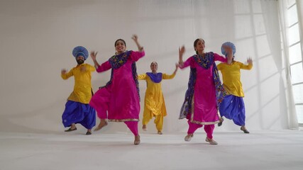 Sikh People performing bhangra during Baisakhi celebration