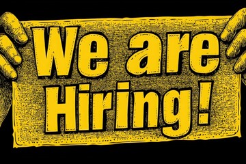 Hands hold up a prominent sign that reads We are Hiring! in bright yellow font. The background contrasts with the sign, capturing attention for job seekers looking for new opportunities.