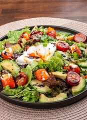 Salmon salad with cream cheese and poached egg