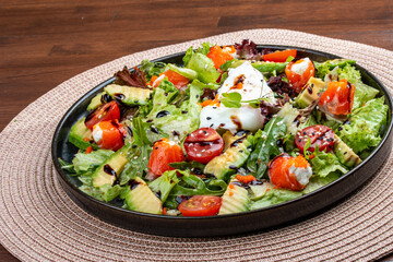 Salmon salad with cream cheese and poached egg