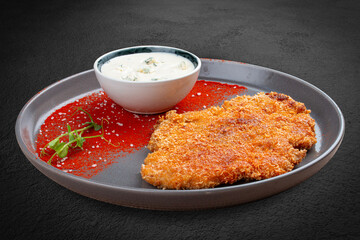 Chicken schnitzel with blue cheese sauce and paprika
