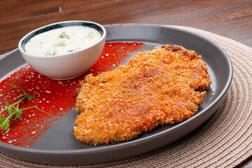 Chicken schnitzel with blue cheese sauce and paprika