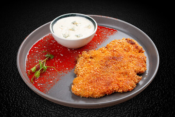 Chicken schnitzel with blue cheese sauce and paprika