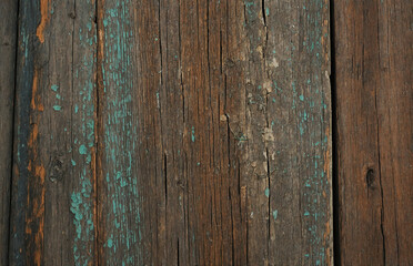 Obraz premium close-up of a weathered wooden texture with cracks and faded paint