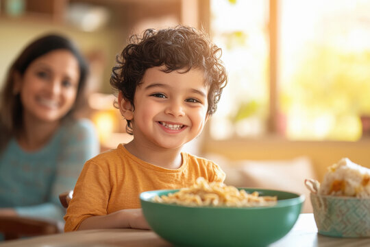 happy indian boy eating hakka noodles