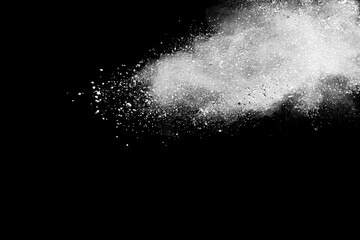 Abstract white powder explosion. Closeup of white dust particle splash isolated on black background	