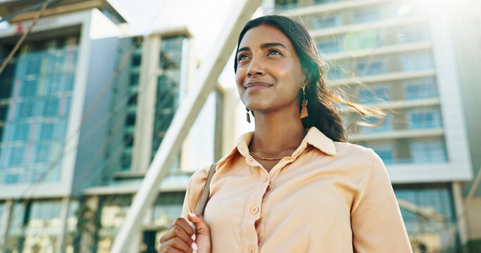 Thinking, low angle and travel with business woman in city for reflection, future and morning commute. Pride, confidence and professional with person in downtown for corporate, vision and memory