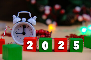 Calendar and new year concept. text of 2025 on colorful wooden blocks with Christmas theme....