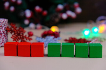 Season's greetings scene. Top view of Christmas decorations, balls, rustic star, holly berries,...
