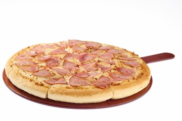 Close-up of a freshly baked ham and cheese pizza.
